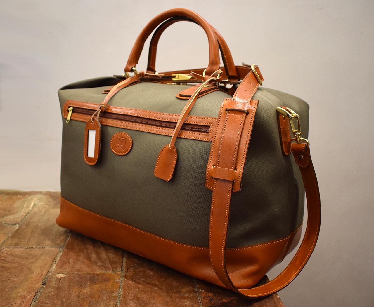 Cube, Italian leather handmade travel bag, green canvas and cognac leather, by Mancini Leather Since 1918